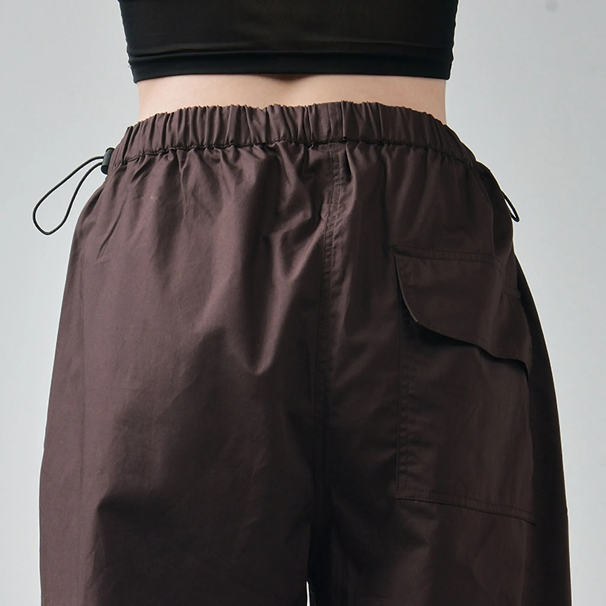 Black Ruffle Top & Brown Parachute Pants